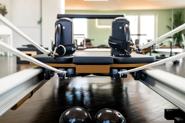 Close-up of a Merrithew reformer in the Little House studio