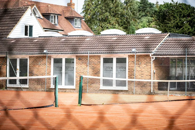 The Little House Pilates studio building beside the tennis courts at the Beaconsfield Tennis Centre